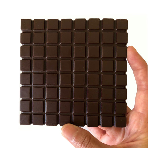 Hand holding Vegan Milk Non-Dairy Chocolate bar – Oat-based plant milk chocolate by Nibble